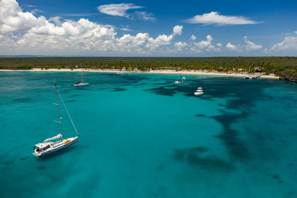 Catamaran sailing in turquoise waters towards Catalina Island Dominican Republic