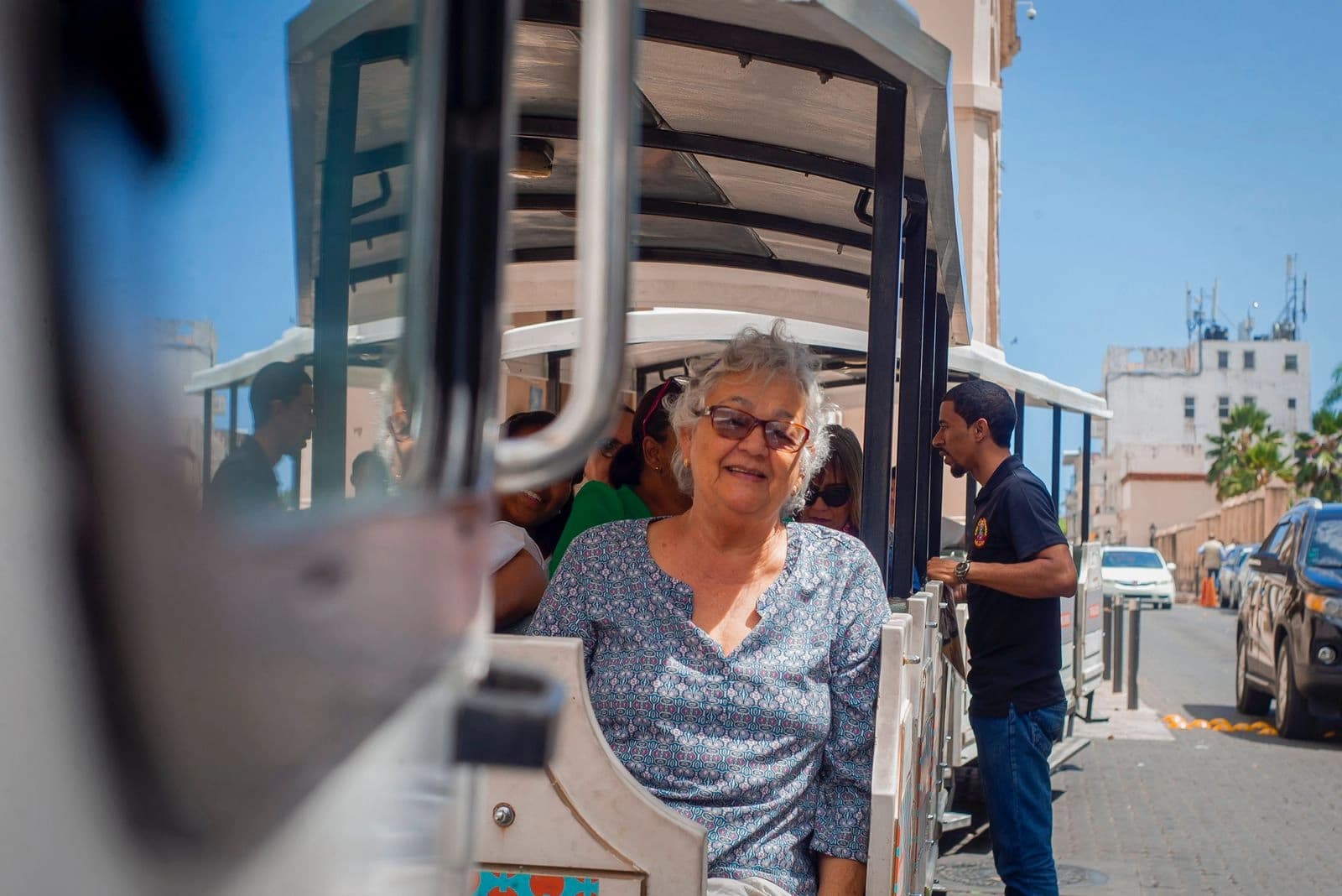 Passenger smiling aboard the Chu Chu Colonial Train in Santo Domingo’s Colonial Zone.