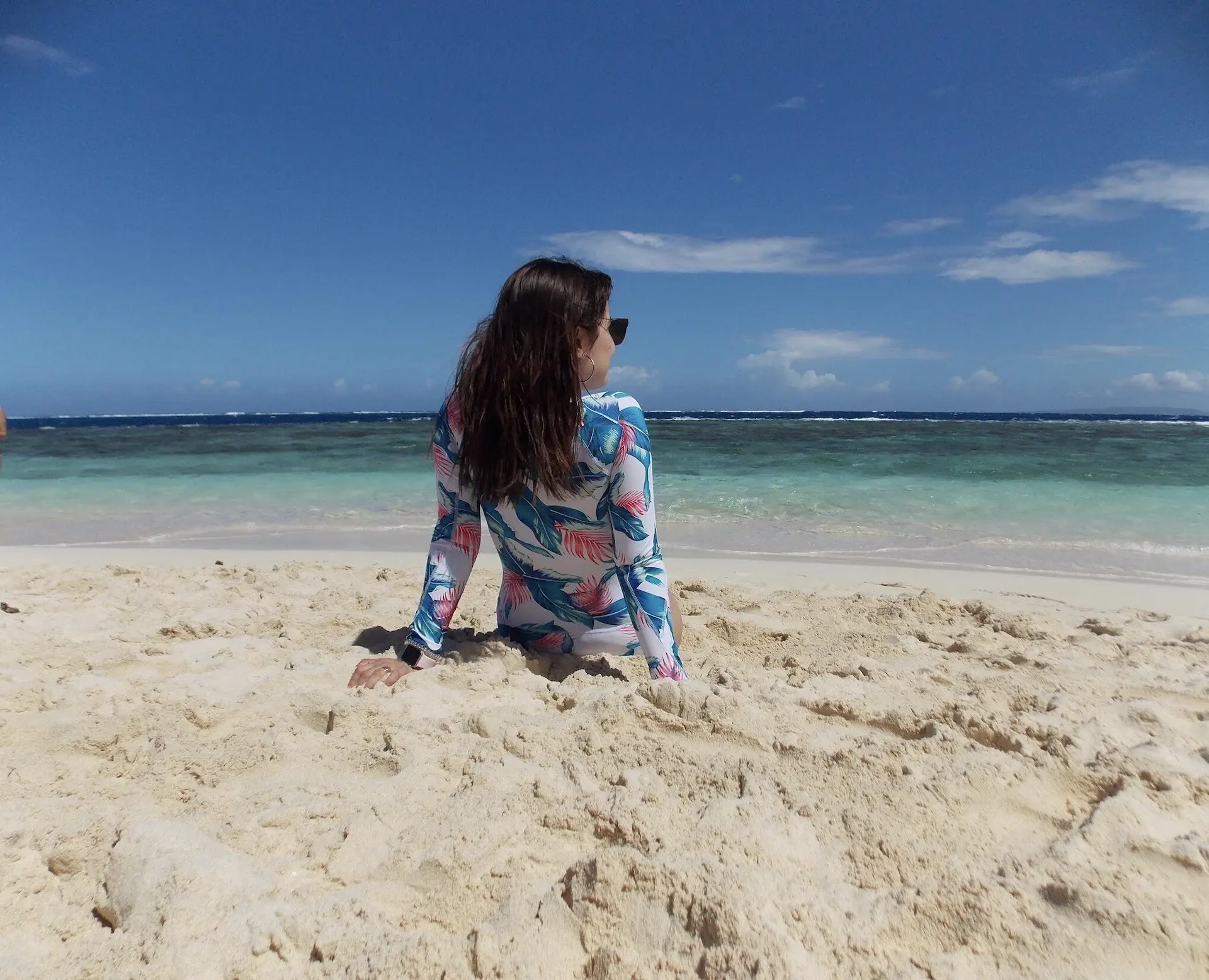 Tourist relaxing on the white sandy beach of Cayo Arena, Paradise Island, Dominican Republic