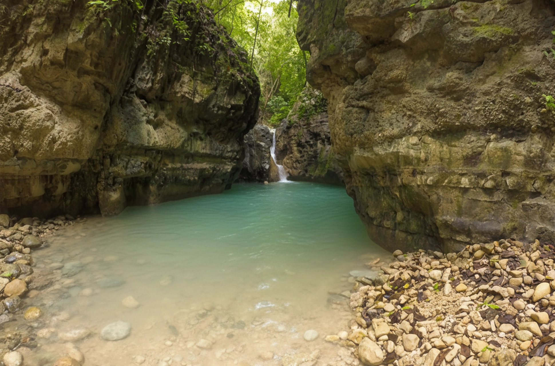 Calm turquoise natural pool at the 27 Waterfalls of Damajagua canyon.