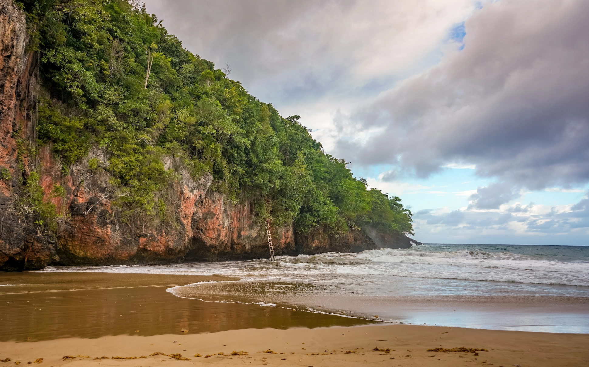 Scenic cliffs and shoreline of El Valle Beach in Samaná