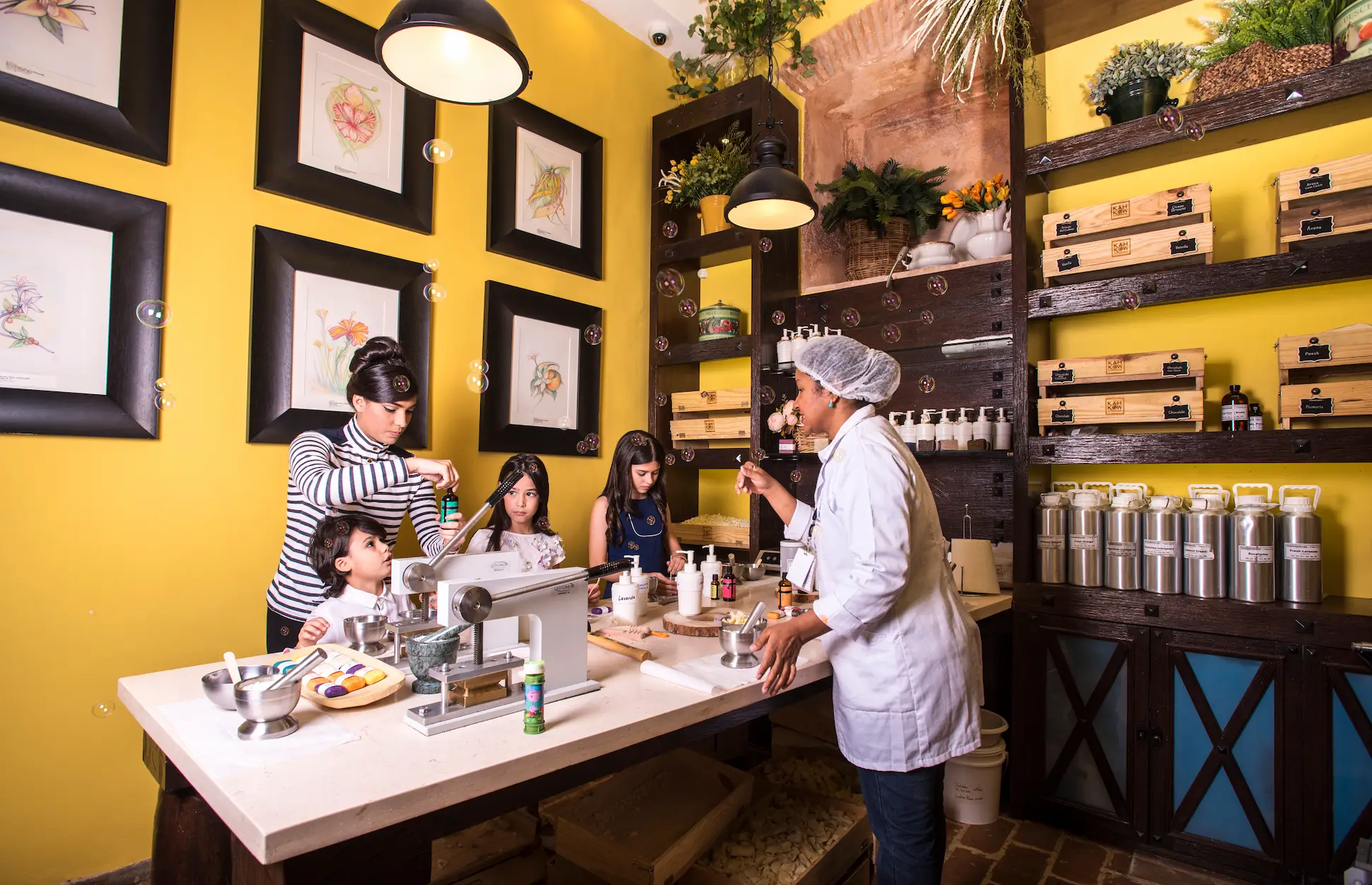 Visitors creating cacao-based cosmetics during a workshop at KahKow Experience in Santo Domingo Colonial Zone