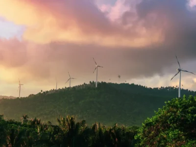Wind turbines at Los Cocos Wind Farm in Pedernales, Dominican Republic during sunset.