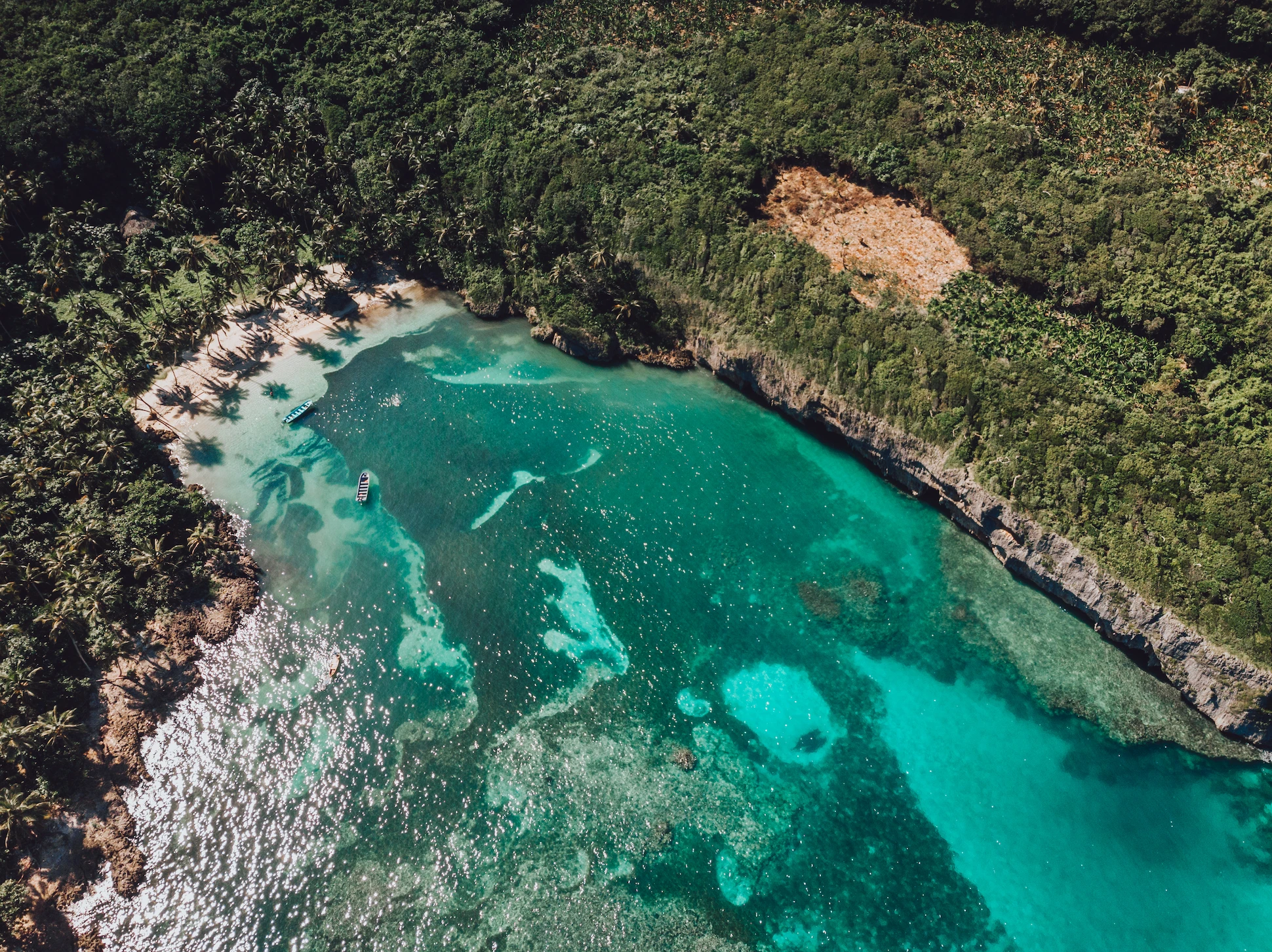 Scenic aerial of Playa Madama bay with coral reefs and palm-fringed shore – Samaná day trip from Santo Domingo