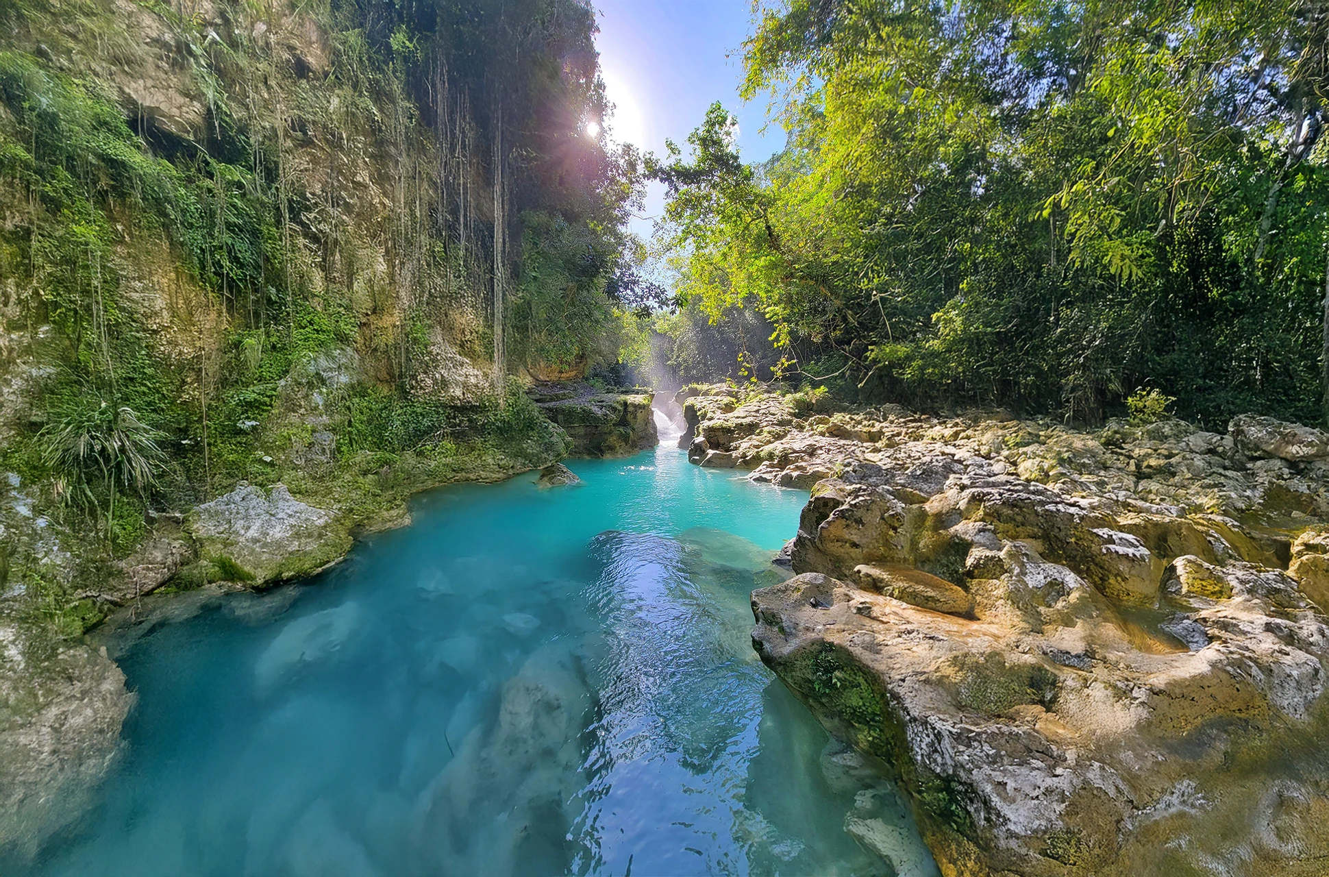 Turquoise waters of Río Partido flowing through limestone canyon in the Dominican Republic
