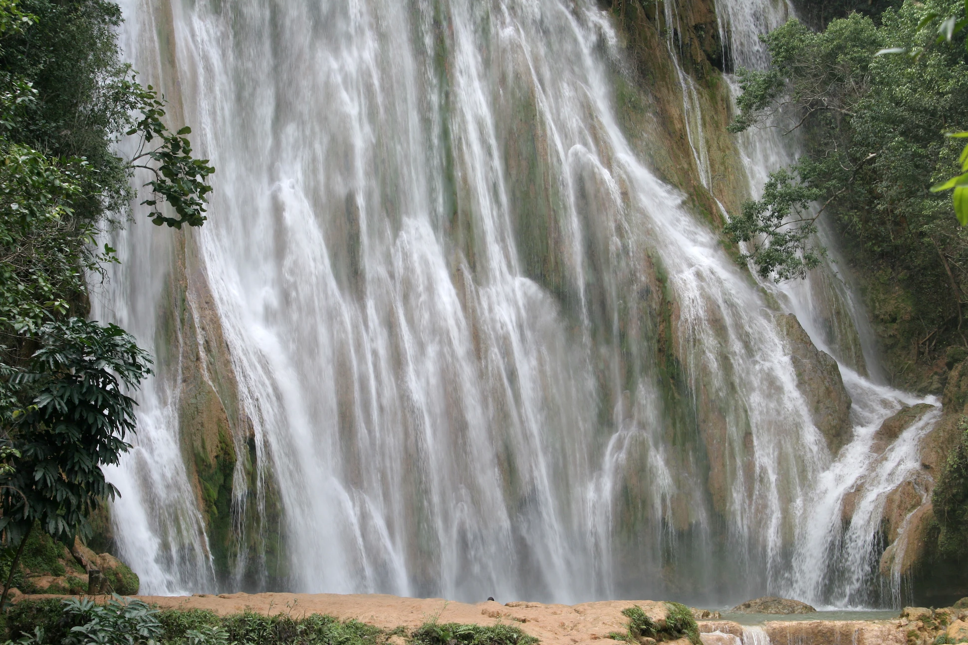 Close-up of El Limón Waterfall cascading down limestone rocks in Samaná.