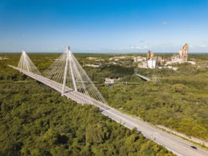 Aerial view of Puente Mauricio Báez in San Pedro de Macorís, Dominican Republic, with industrial zone in the background