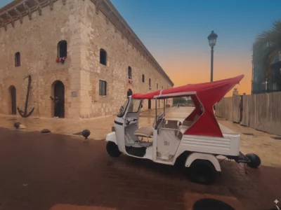 Tuk-Tuk parked in front of Atarazanas Reales in Santo Domingo’s Colonial Zone at sunset